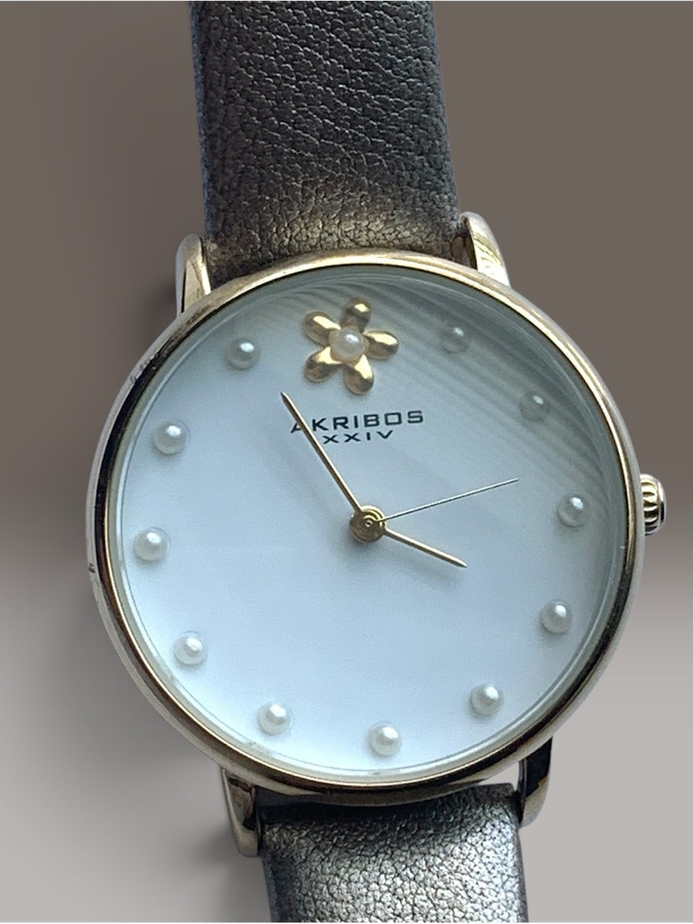 Akribos XXIV White Dial Pearl Marker Watch with Gold Accents